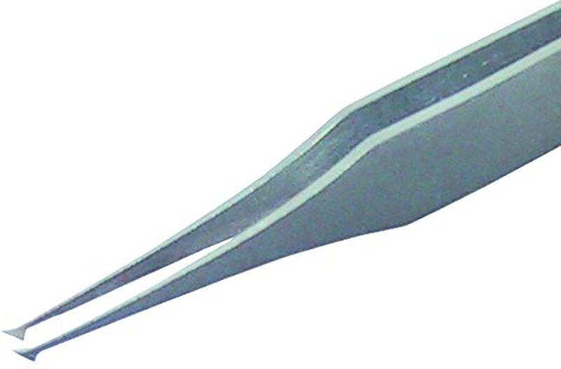 Tweezers for handling chips and SMD components.
